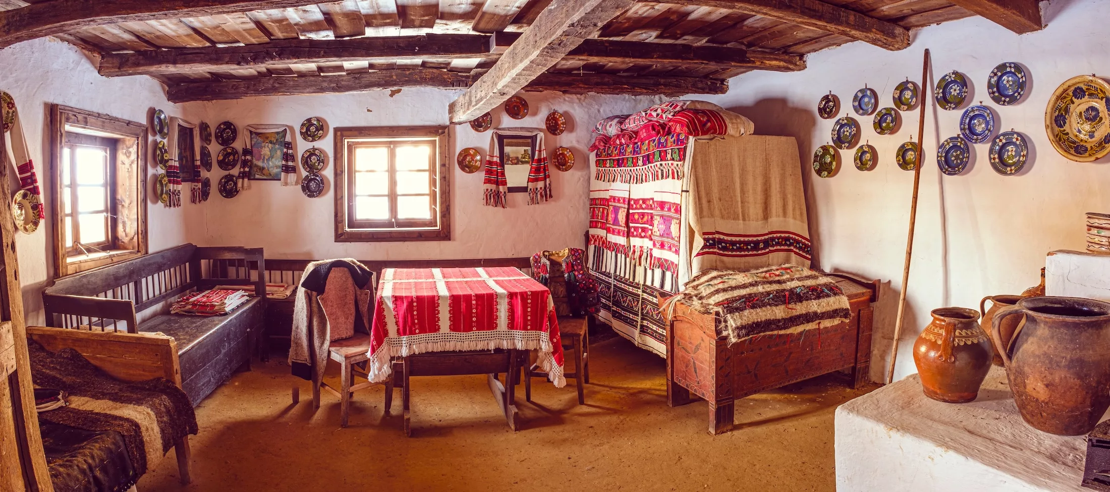Sibiu, Romania - February 11, 2023. Traditional Romanian folk house interior with rural furniture and decoration.