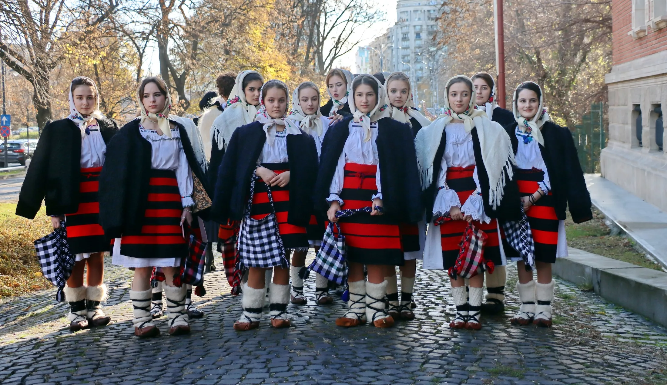 Bucharest, Romania, December 20, 2023 - Group of carolers from Romania, Maramures. Carolers dressed in traditional clothes. Carols on Eve, Christmas and New Year, winter holiday traditions. Singers