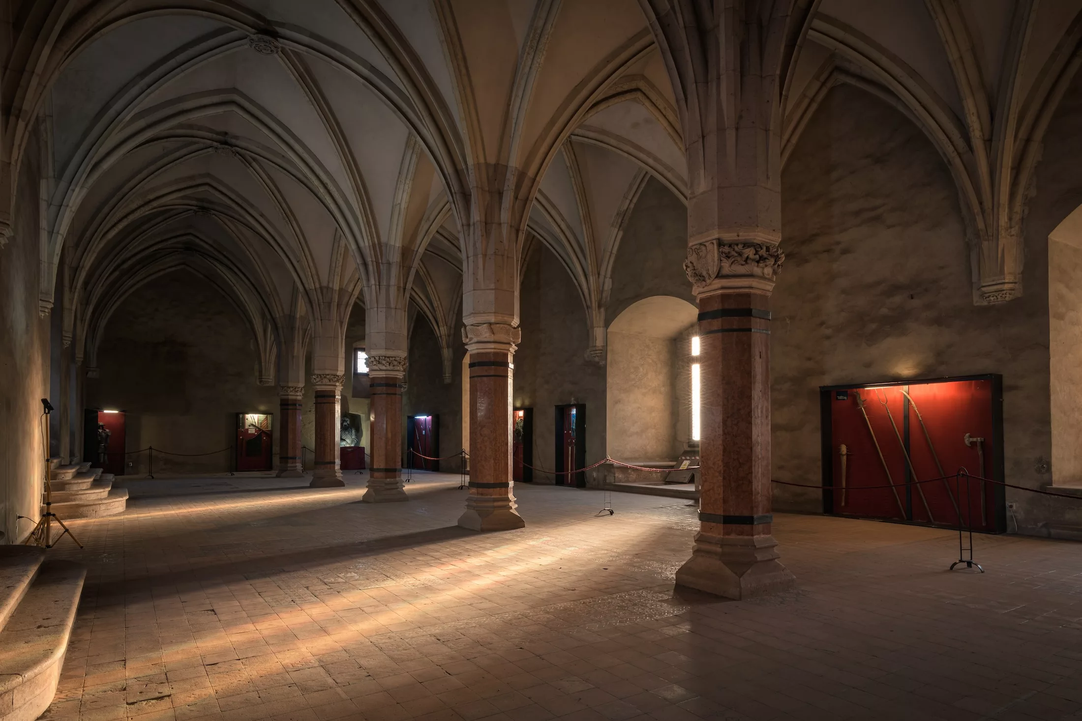 Hunedoara, Romania - August 2019: Corvin Castle knights hall, or Hunyadi Castle, one of Seven wonders of Romania. Large, medieval Gothic-Renaissance building.