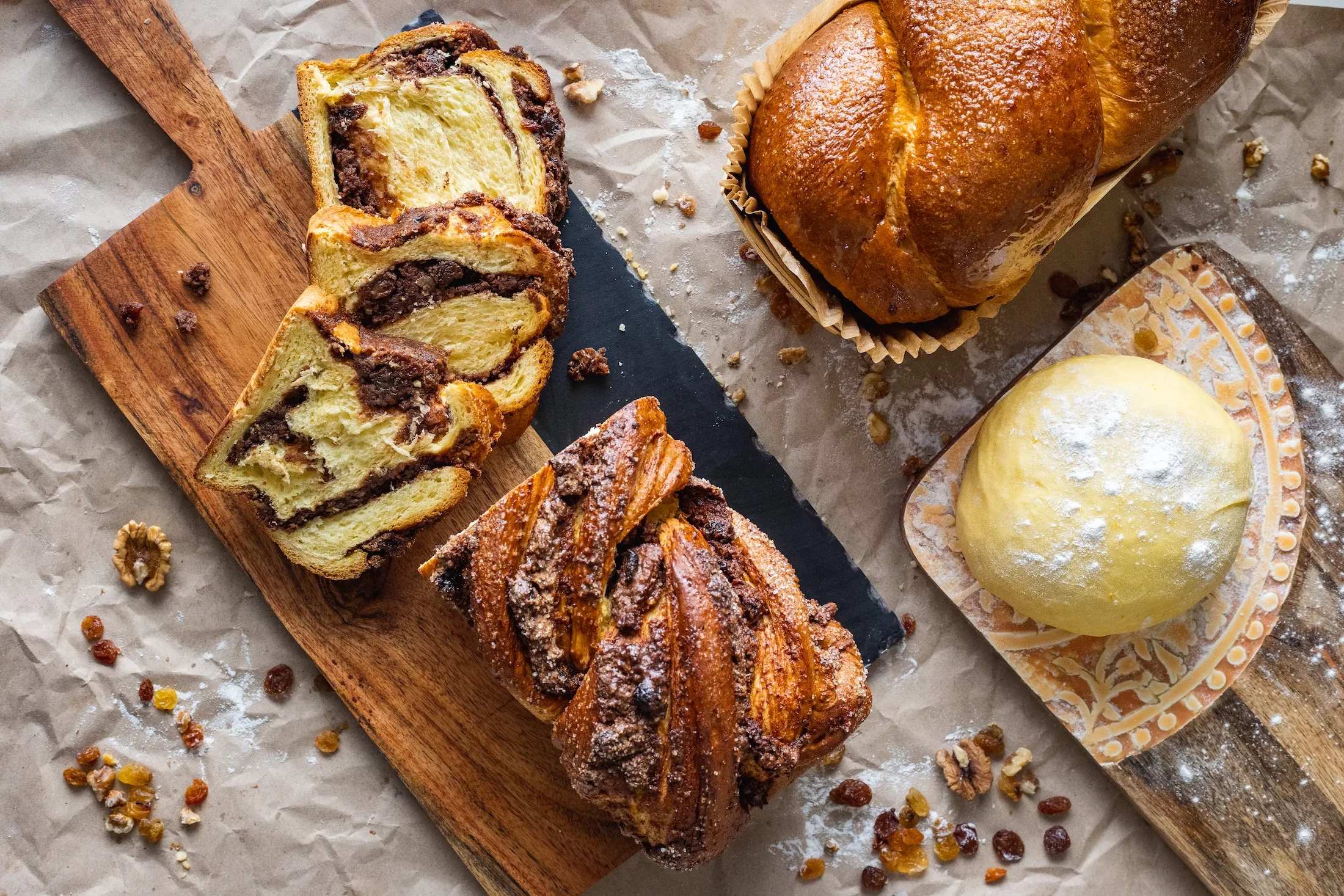 Flat lay of some Romanian sweets, called Cozonac, done two ways, the traditional one and in the Turkish Babka style.