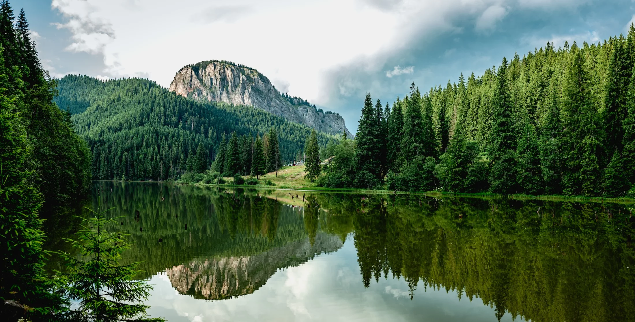 Summer scenery of mountain lake Lacul Rosu (Red Lake or Killer Lake). Popular travel destination and place for active rest and adventures in Eastern Carpathians. Harghita County, Romania