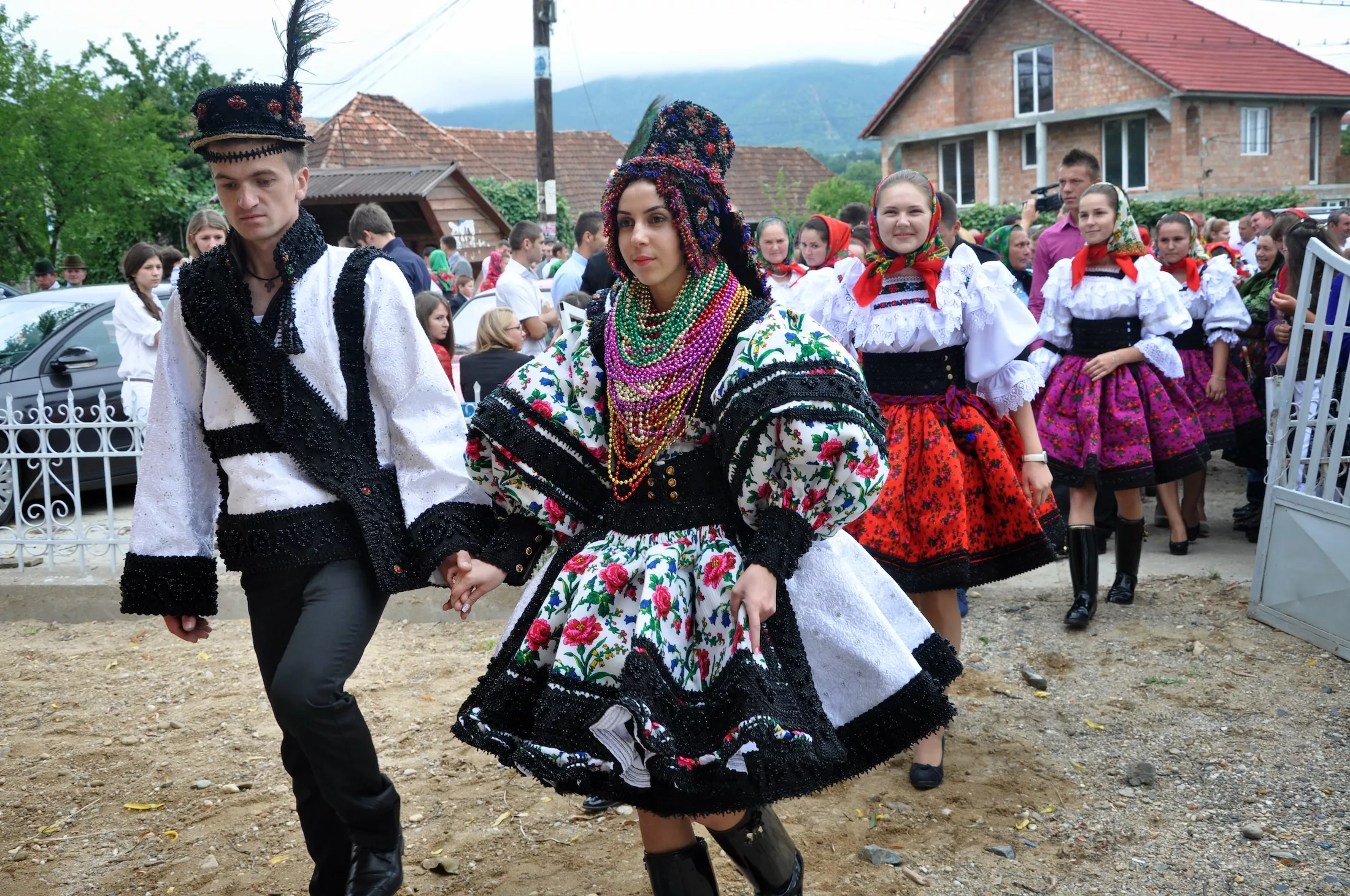 GHERTA MICA, ROMANIA - JULY 12: Unidentified villagers in traditional dresses celebrate a traditional Romanian wedding on JULY 12, 2012, in Gherta Mica, Maramures, Romania.