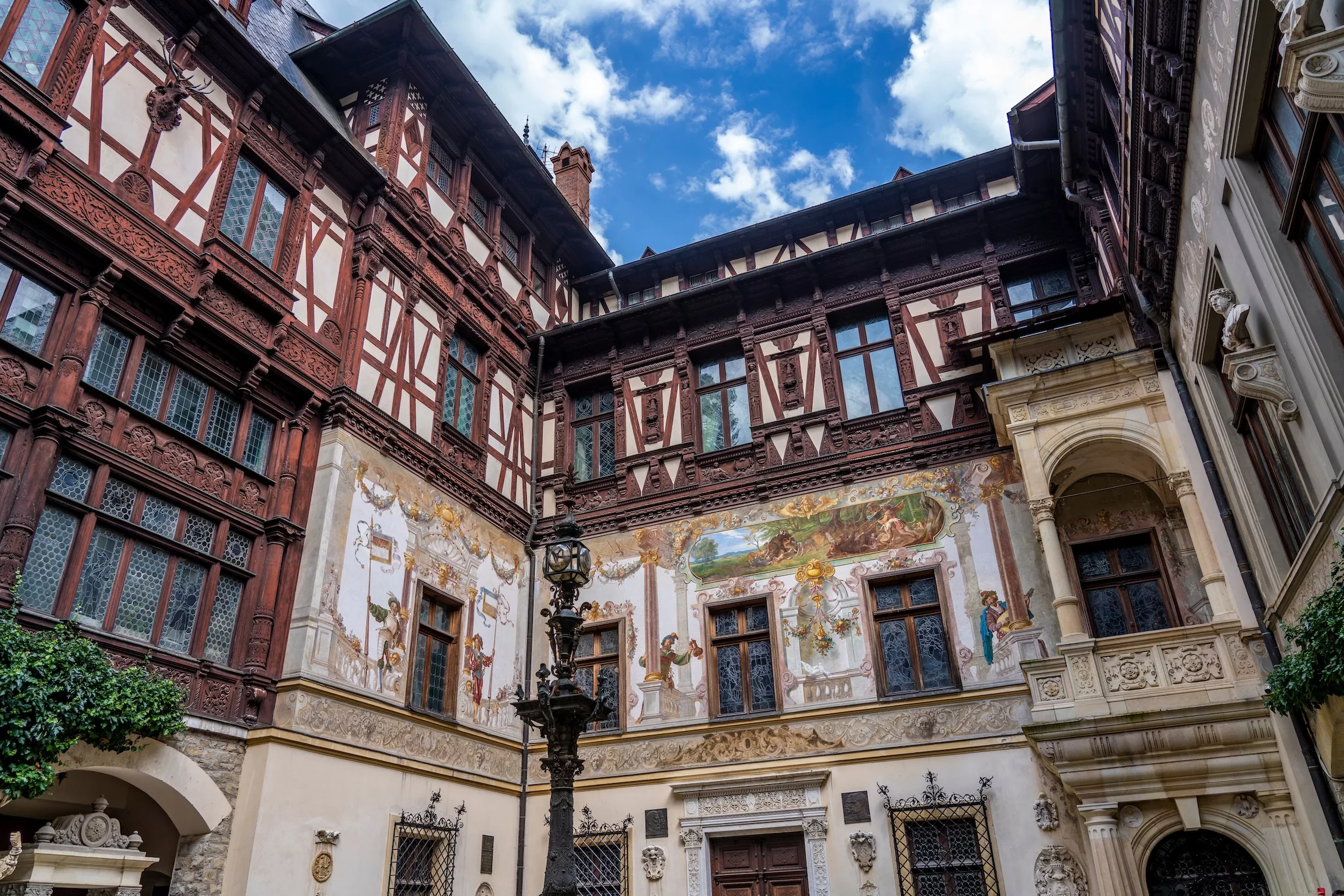 Famous Peles castle in Romania, inner court with decoration - Peles, Sinaia, Romania, Europe - 15 August 2023