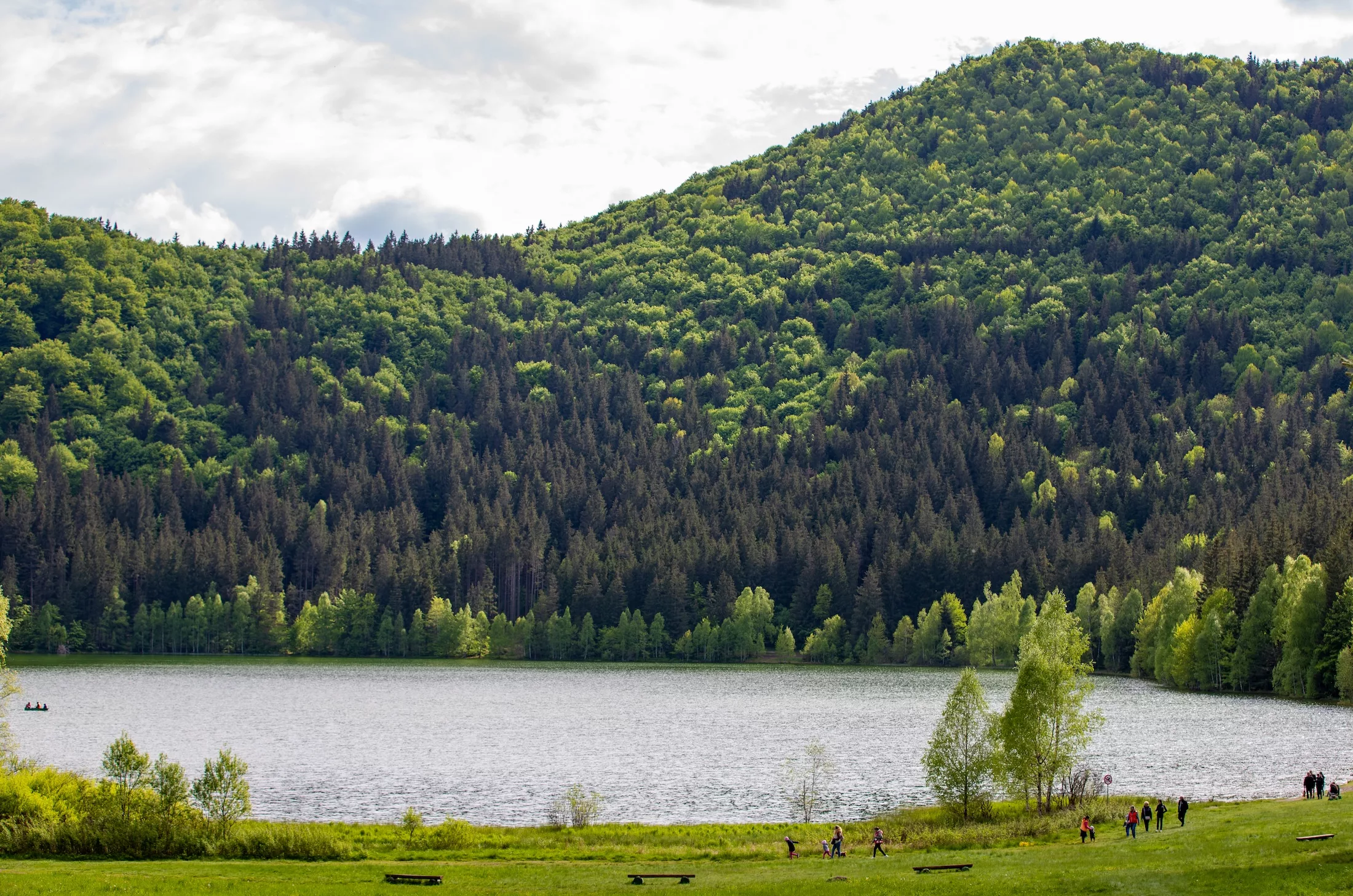 tourists on the shore of Lake Saint Ana in Romania 31.May.2021 It is the only volcanic lake in the country