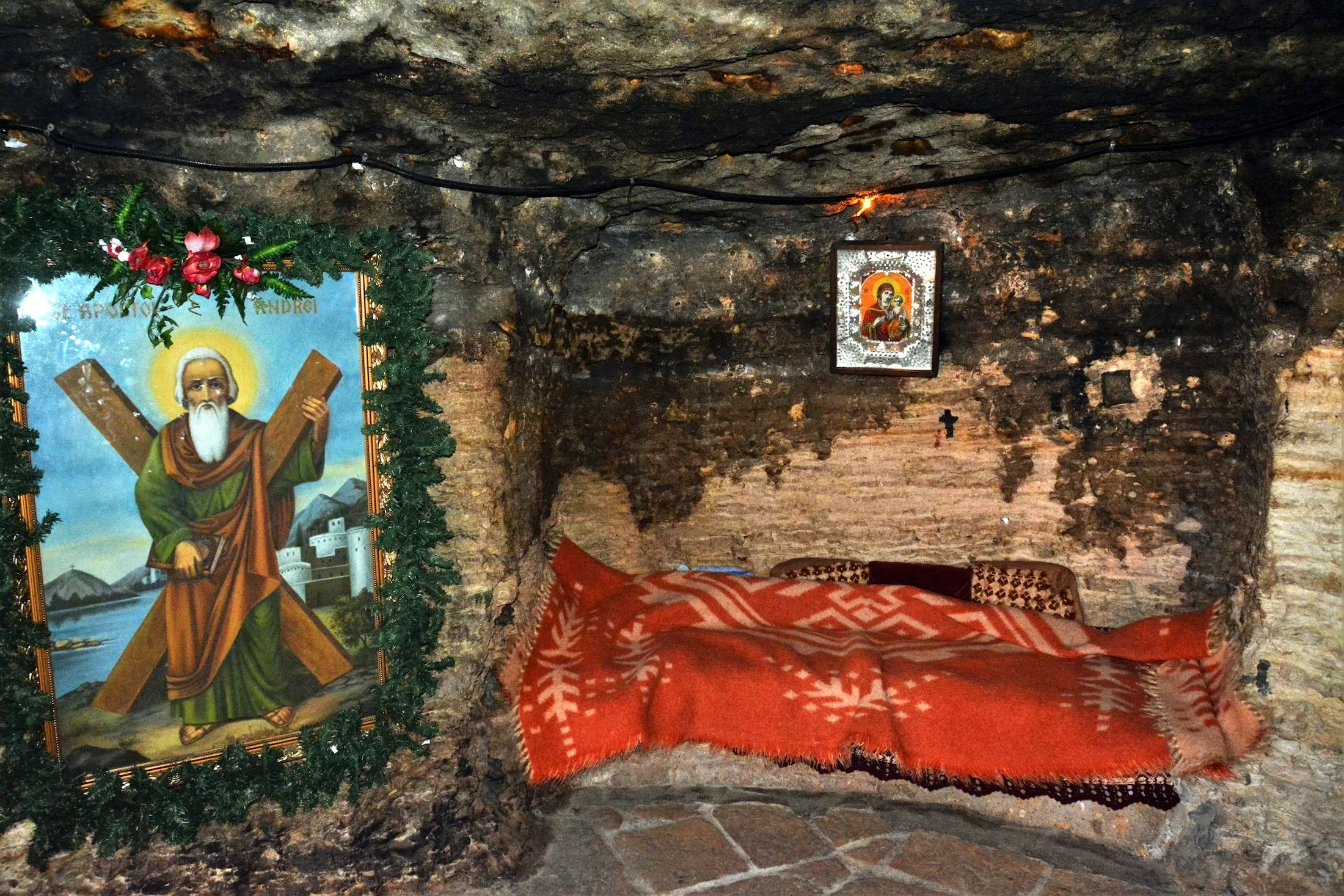 icons painted inside the cave at St. Andrew's Monastery in Constanta County - Romania. Nov.19.2016. It is the cave in which the folk tradition claims that the Apostle Andrew lived and Christianized.