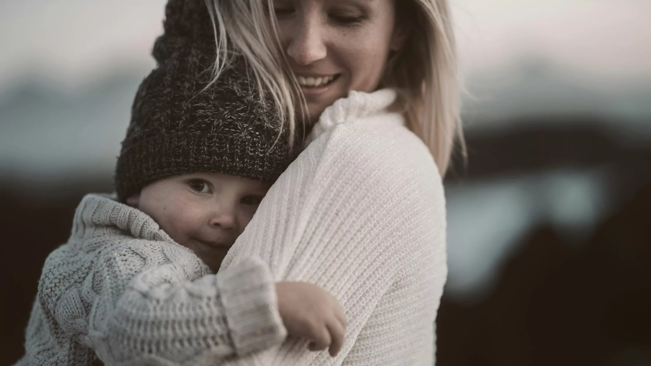 MOTHER HOLDING BABY